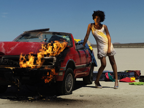 Saleisha in a Car burning in the Desert in this photo shoot