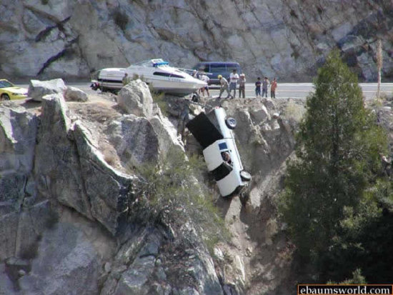 truck hanging off a cliff with boat accident