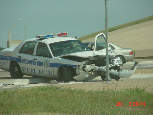 police car accident. Another crashed police car: this one hit a light pole 